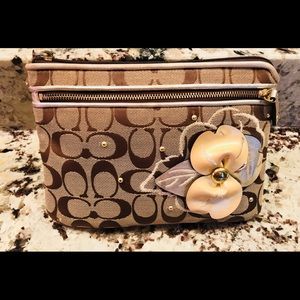 Coach brown signature wristlet with gold flower